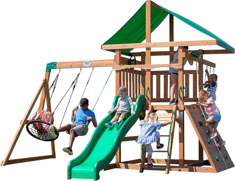 A complete set of wooden mountain-style swings, equipped with a colorful canvas sunshade, a wave slide, a rope swing, a net swing, and a rock wall with climbing ropes and ladders. Z5